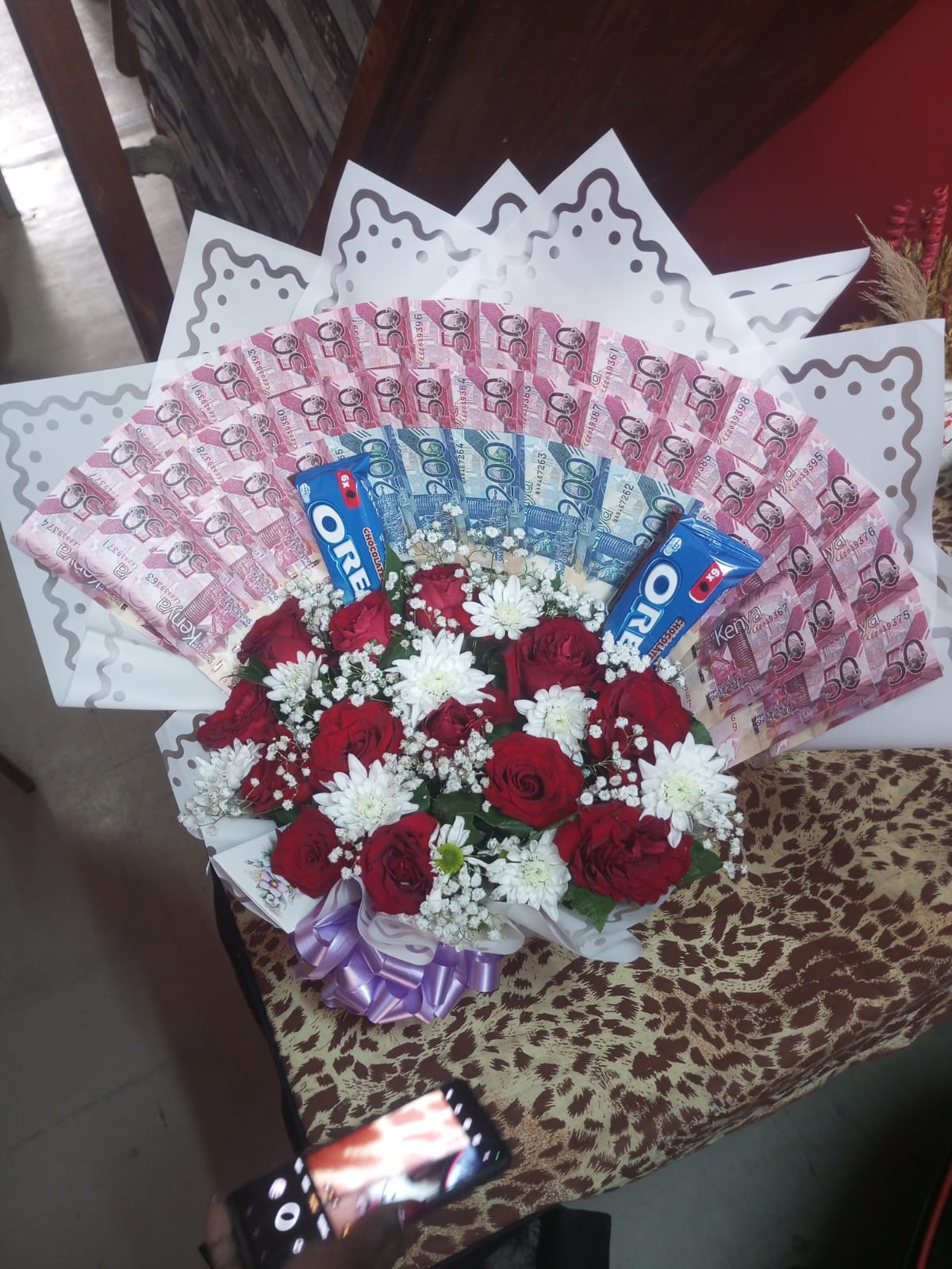 Money and flower bouquet by Leon Events